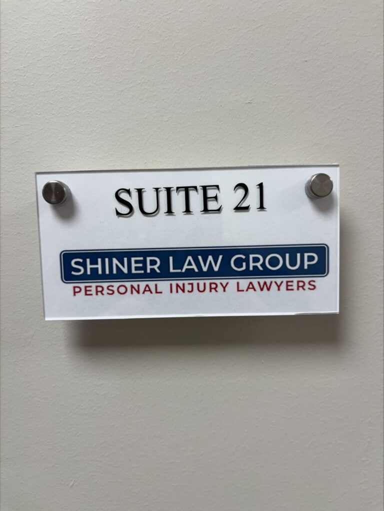 Shiner Law Group Suite 21 door plaque at the West Palm Beach office
